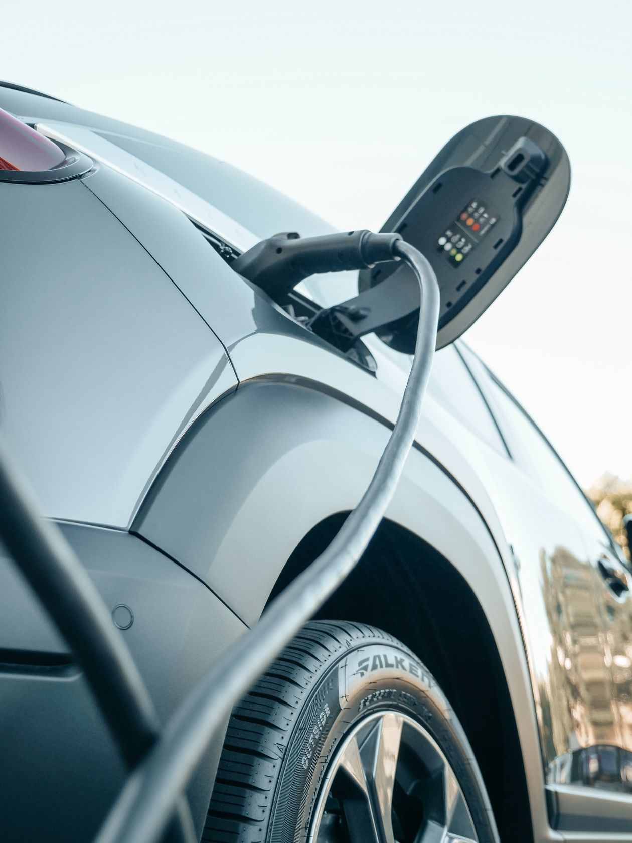 Electric vehicle plugged into a home charging station
