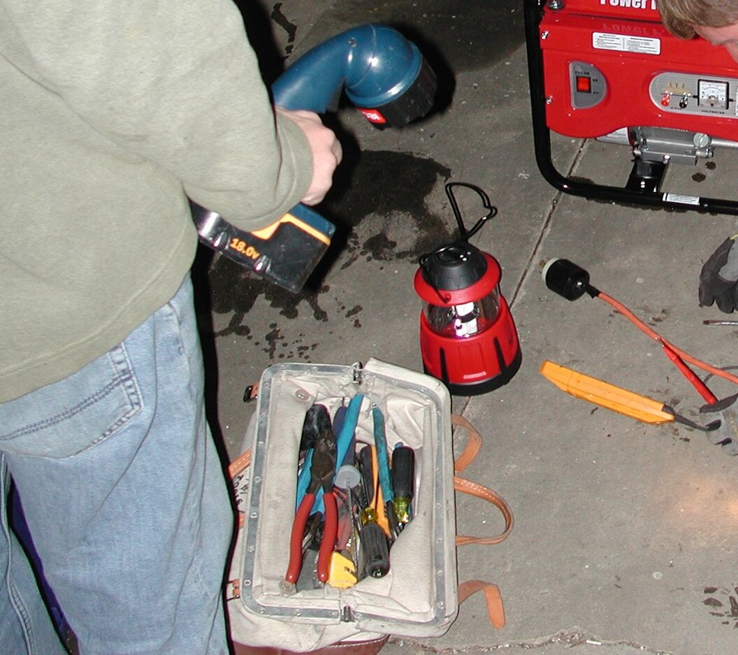 Electrician's tools and wiring during a repair